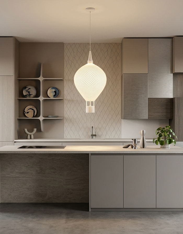 A 3D printed pendant lamp lit above a kitchen island