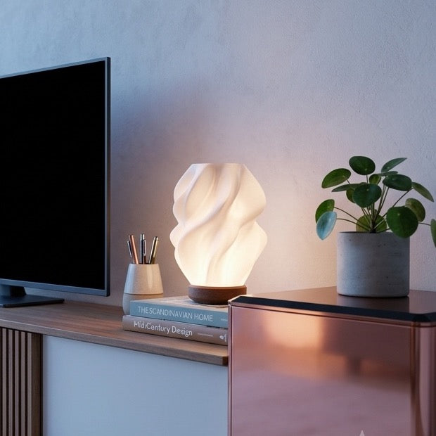 Ovarana Sanjh table lamp lit on a media console at dusk